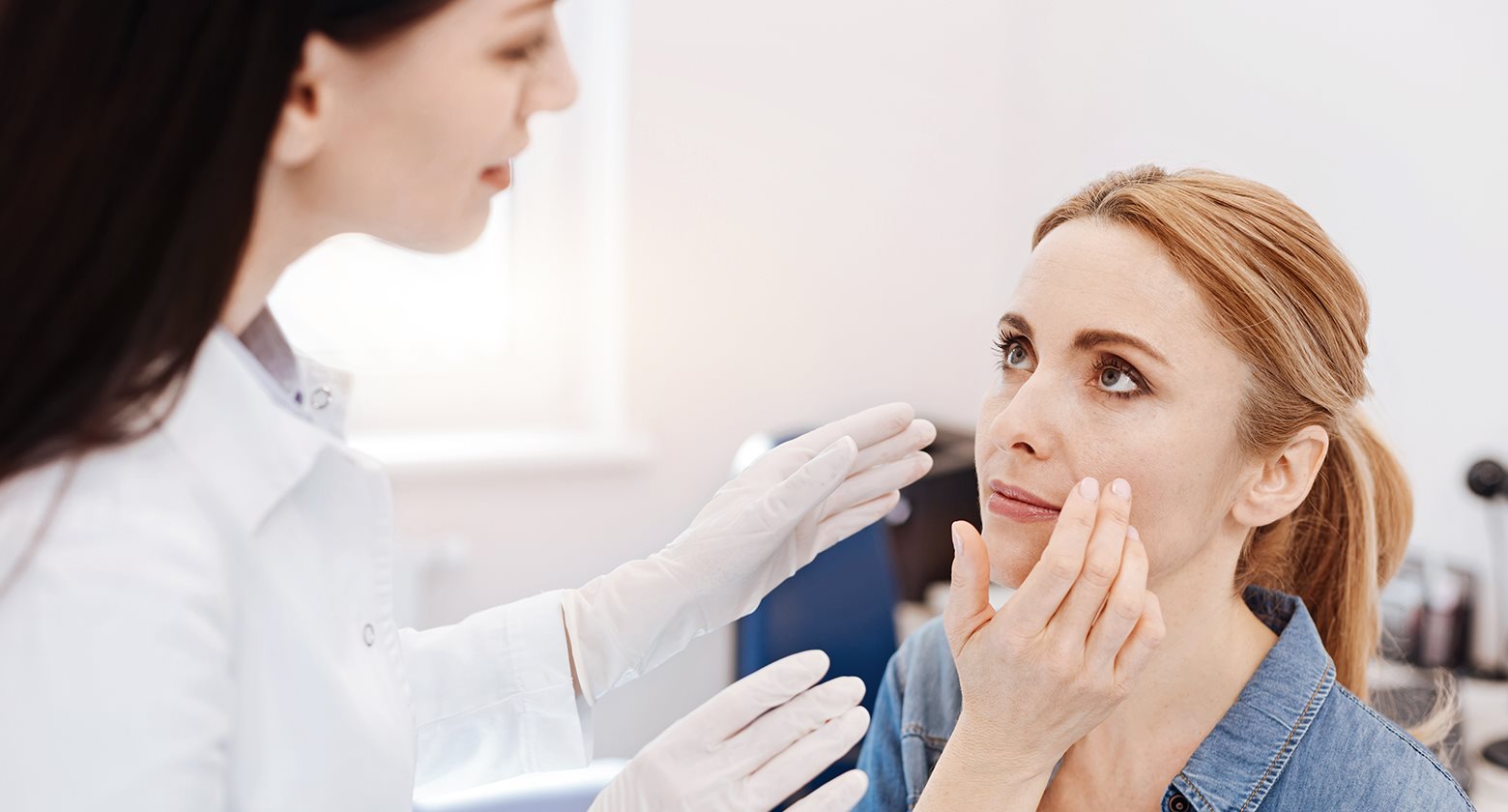 Acne doctor examining skin