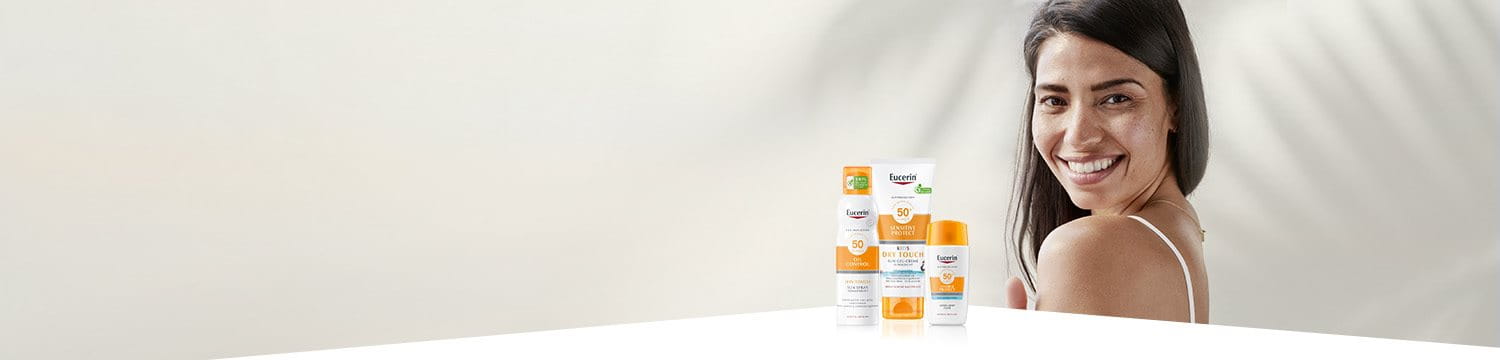 produkty sluneční ochrany Eucerin a usmívající se žena