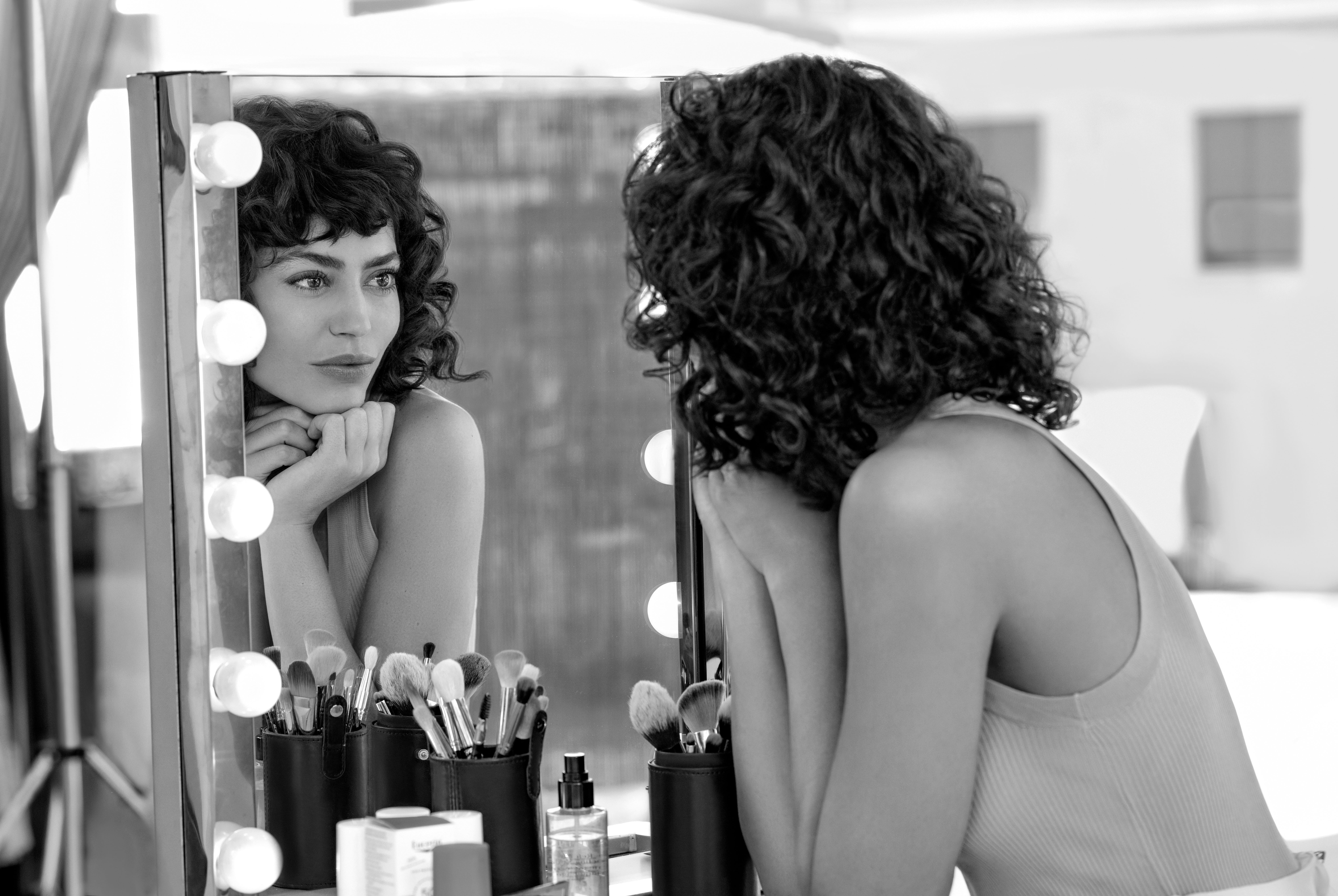 Woman looking in mirror