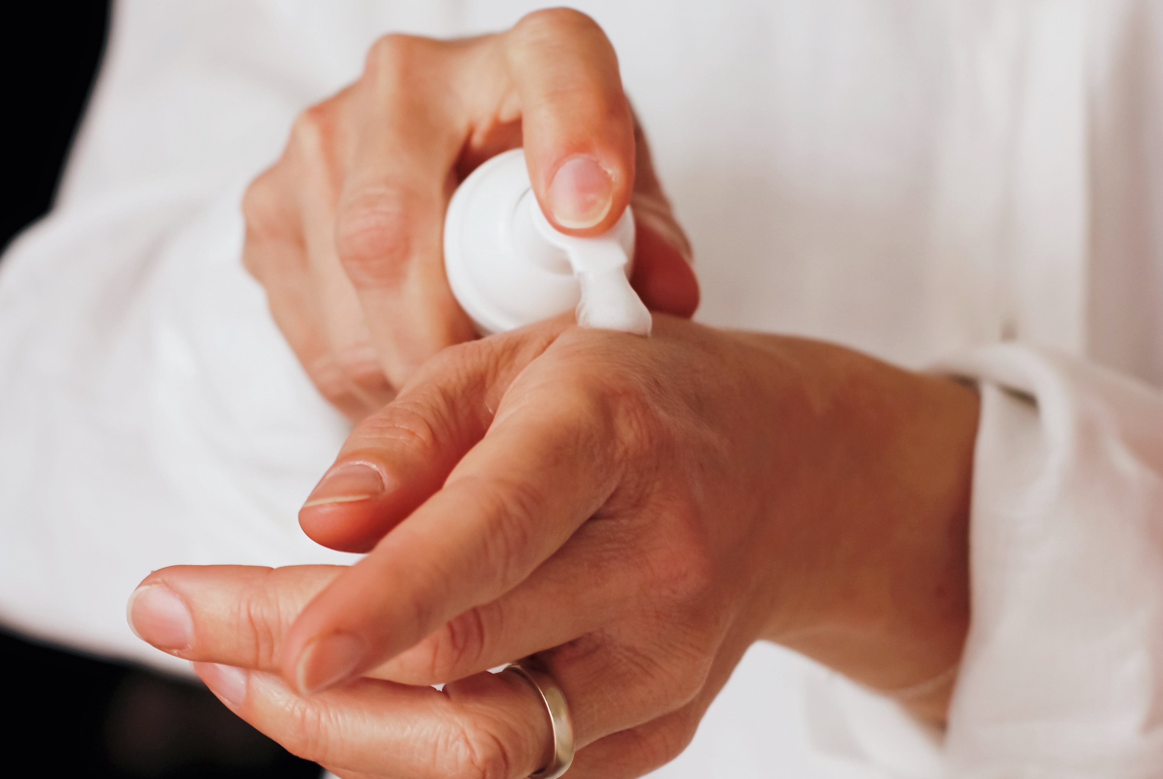 Applying lotion to hands