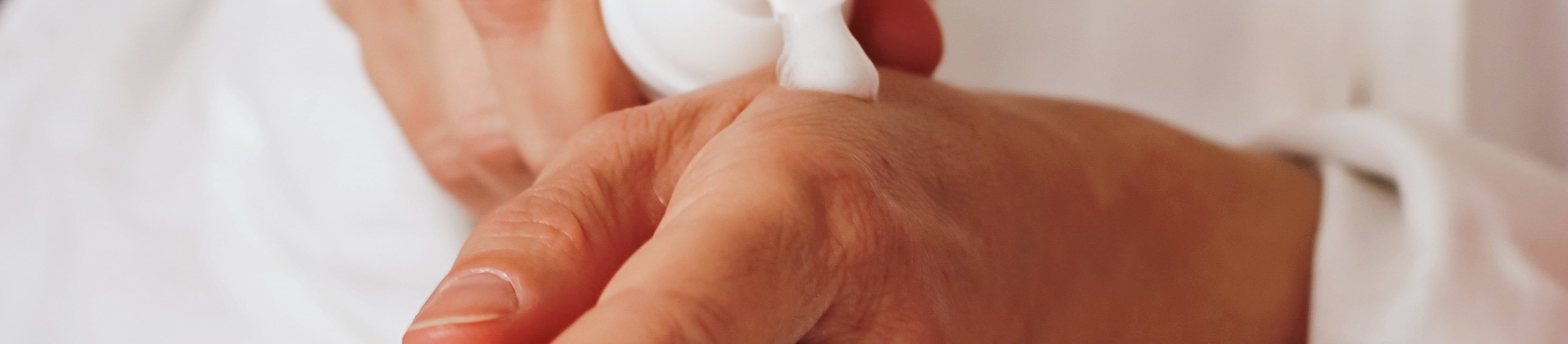 Applying lotion to hands