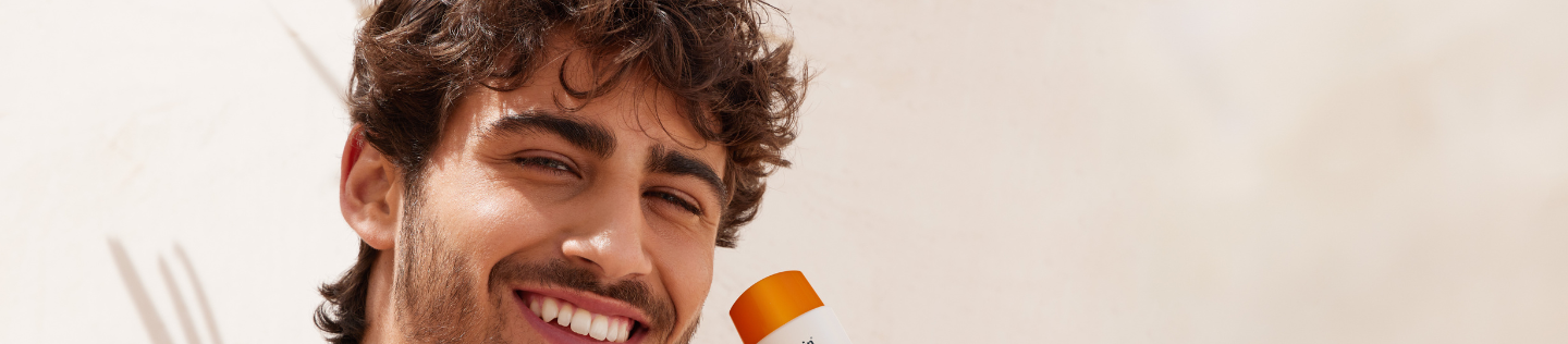 man using Eucerin sunscreen