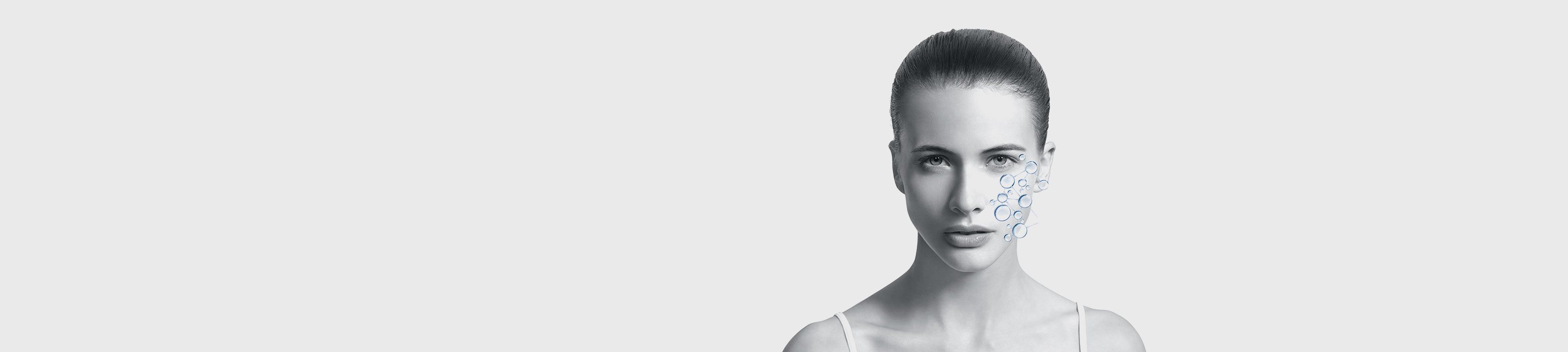 viso di donna in primo piano con grafica che rappresenta l'idratazione