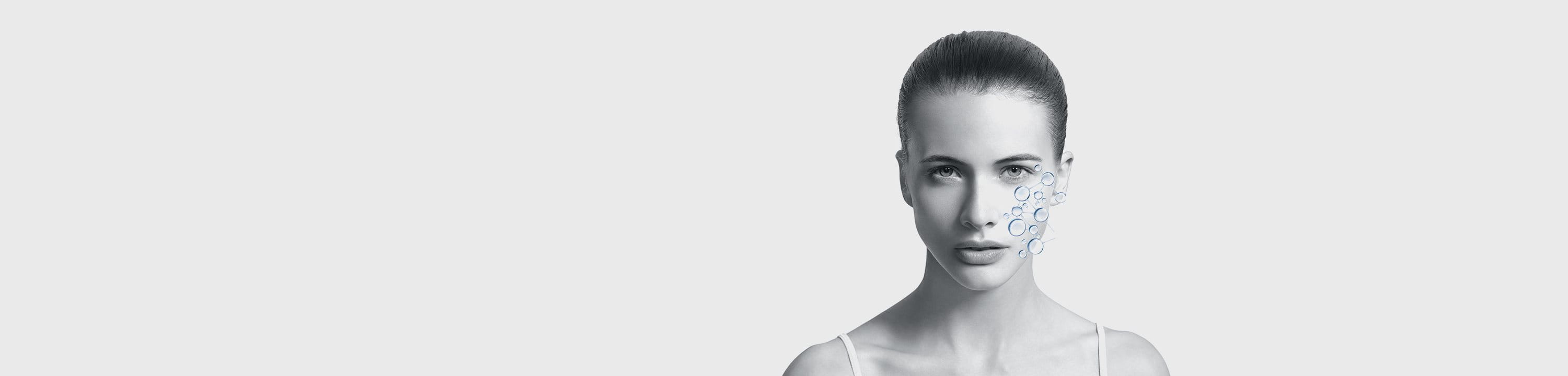 viso di donna in primo piano con grafica che rappresenta l'idratazione