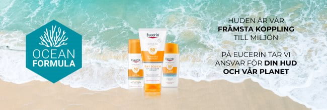 Ett urval av Eucerin Sun produkter vid en stran och blått turkost hav