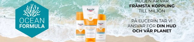 Ett urval av Eucerin Sun produkter vid en stran och blått turkost hav