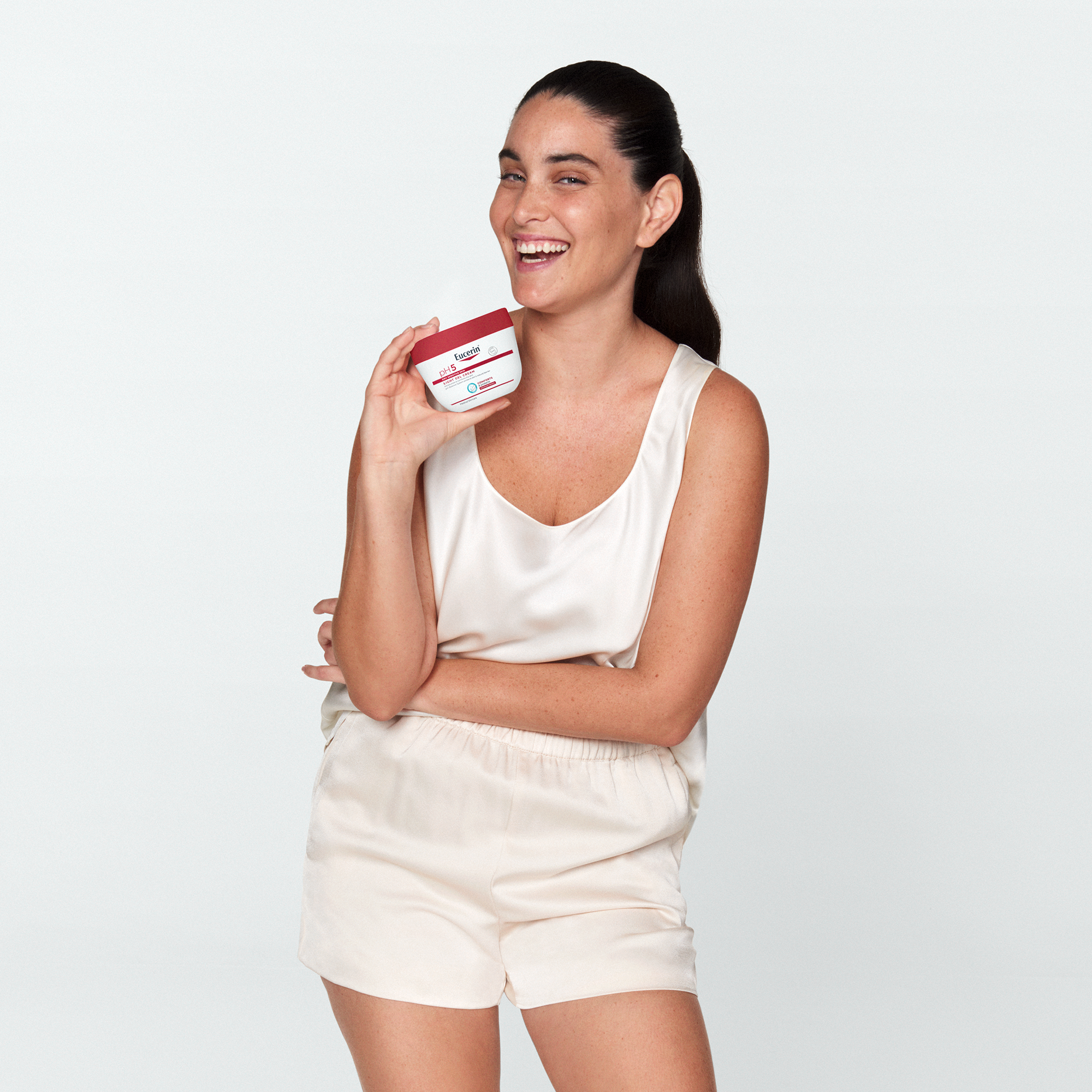 Woman holding light gel cream