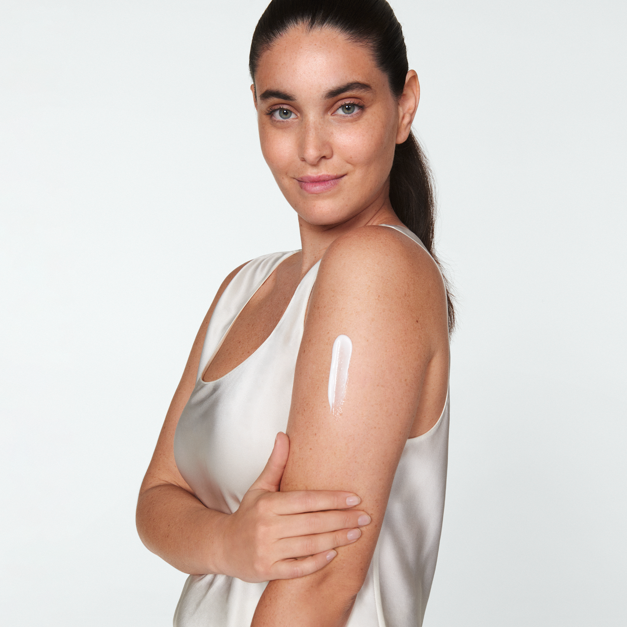 Woman with cream on her shoulder