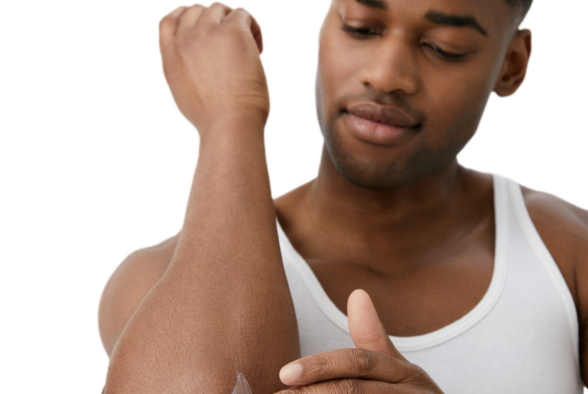 man applying cream to help skin barrier