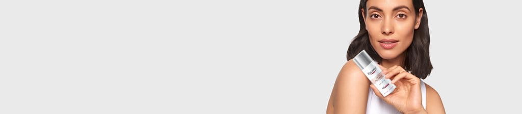 Girl with Eucerin Skincare Product