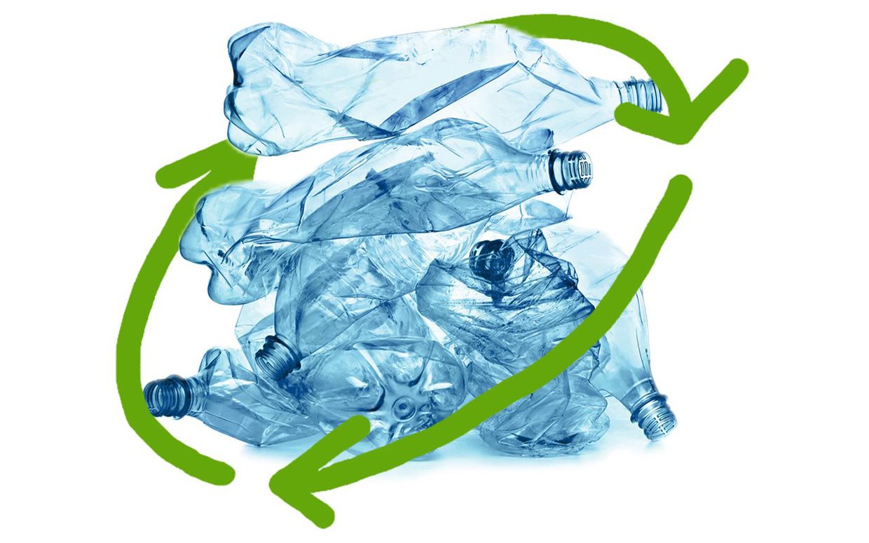 Crushed blue plastic bottles surrounded by a green circular recycling arrow on a white background.