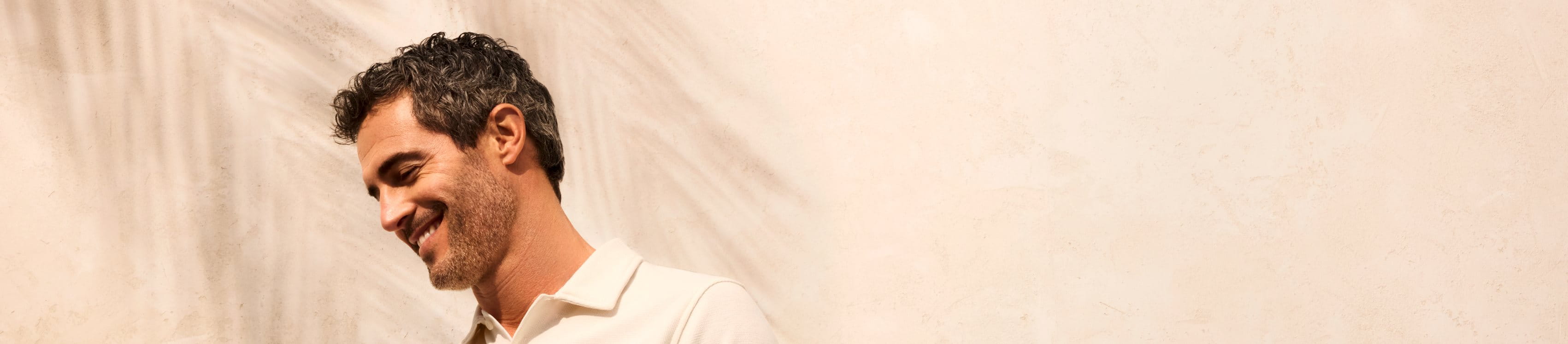 man standing under sun