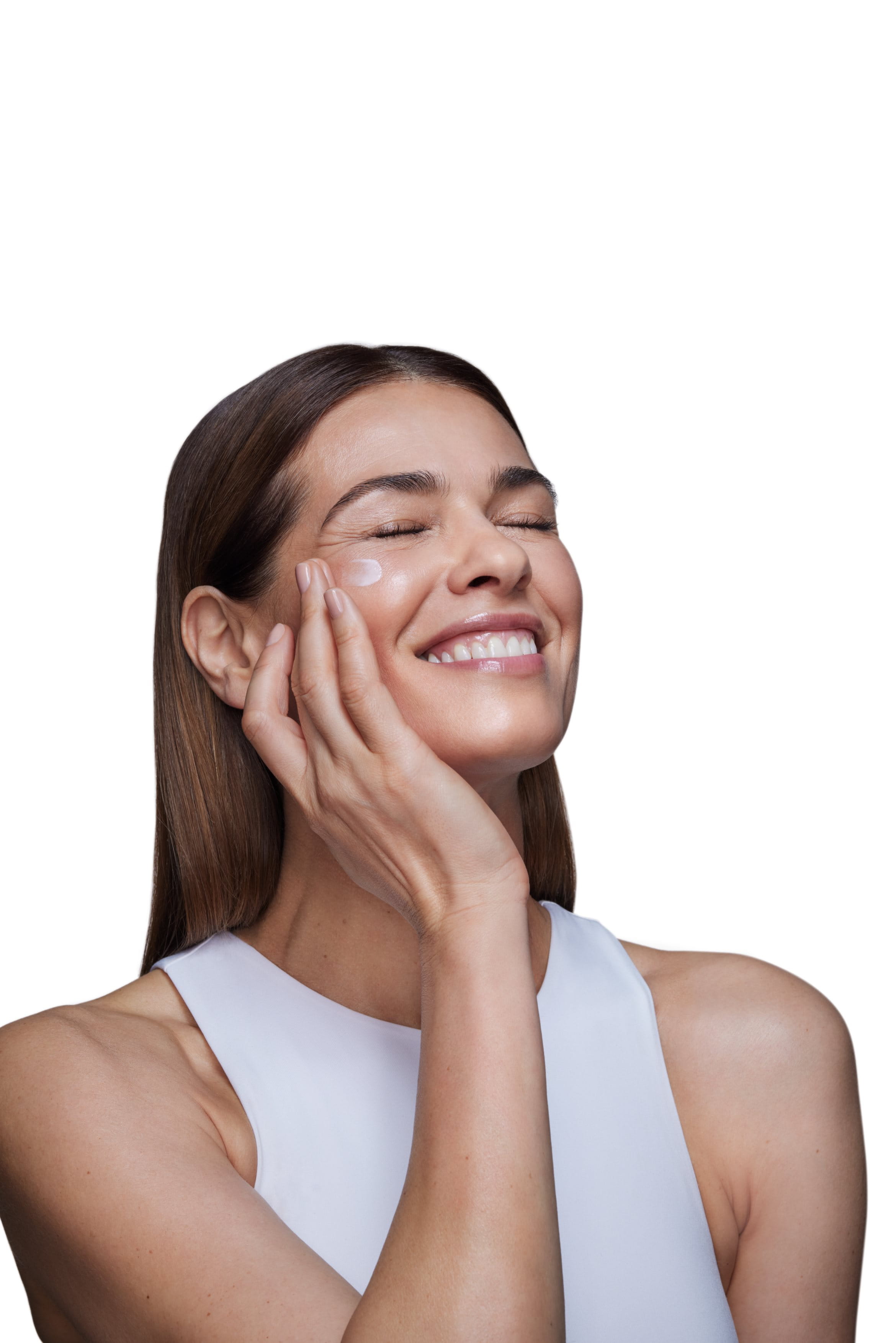 a woman applying creams to her face.