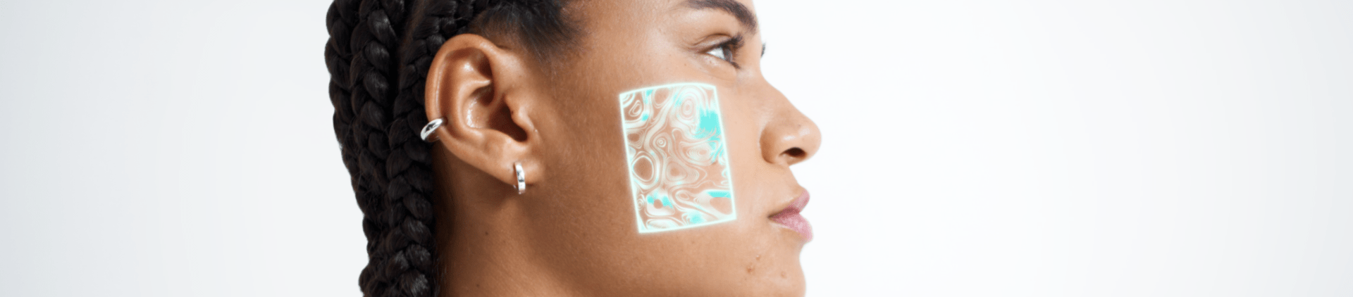 Woman washing her face in the mirror