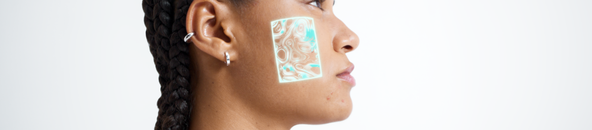 Woman applying lotion to her face