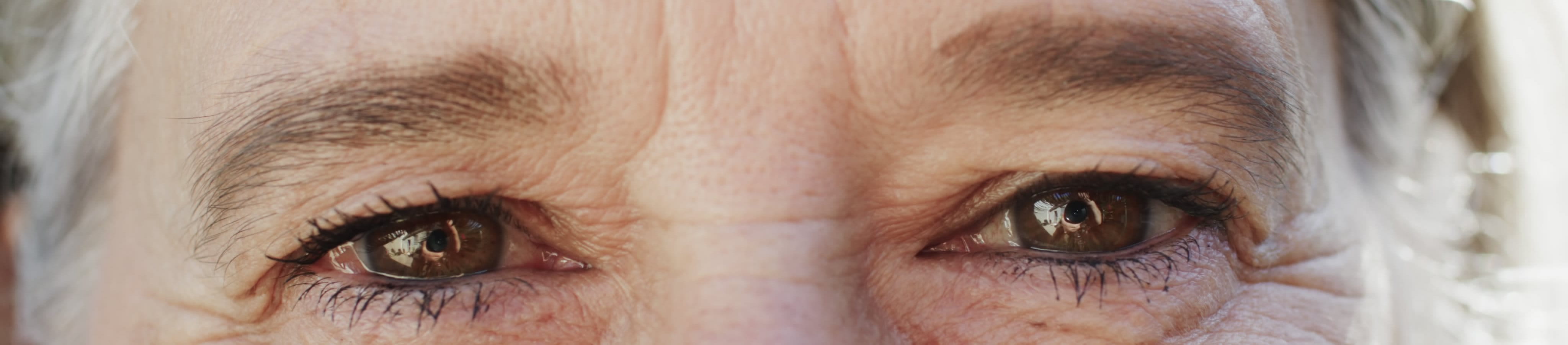 A close up look of woman with mature skin and frown lines