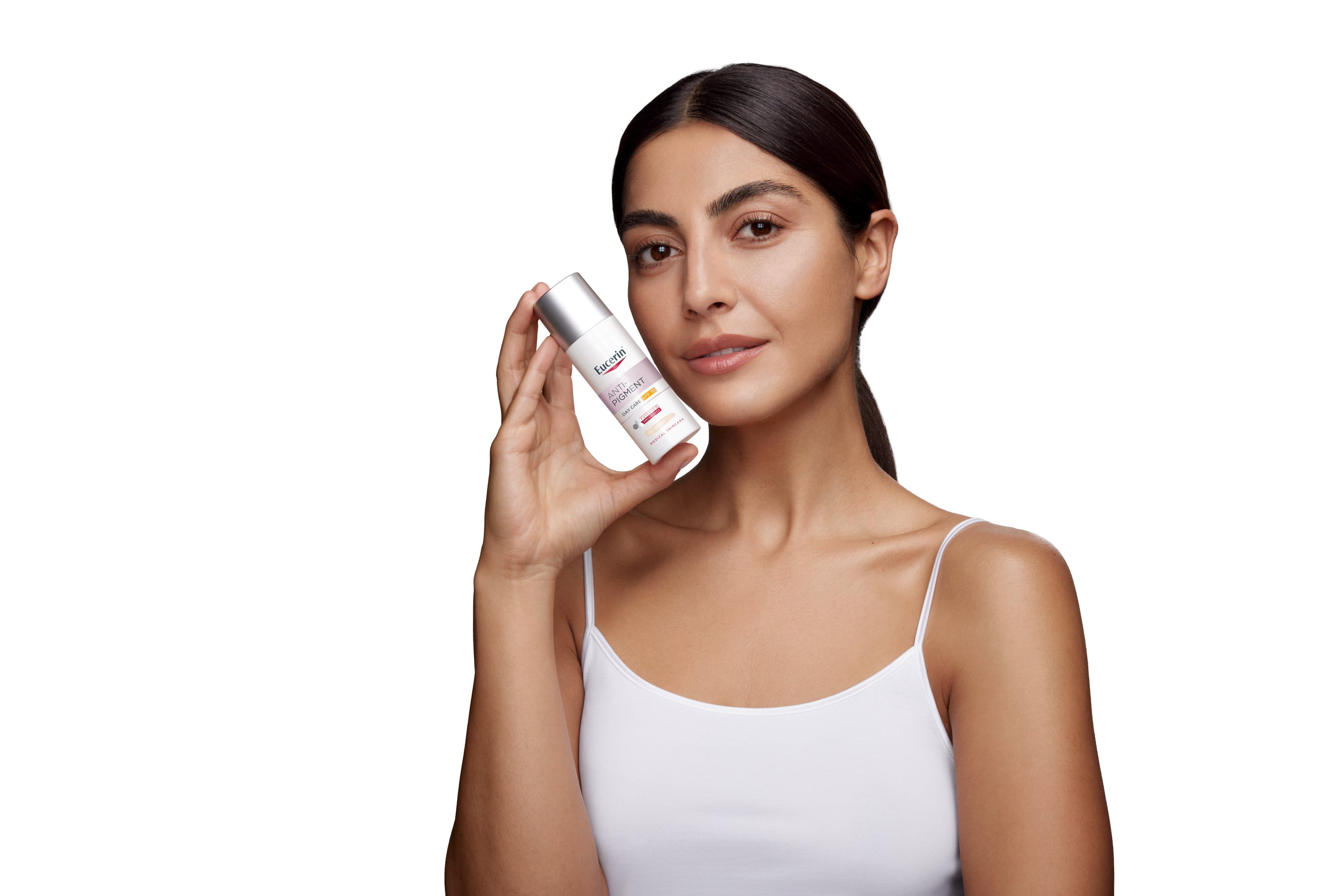 image of a persons hand holding Eucerin Anti-Pigment Day Cream SPF 30 on a white background