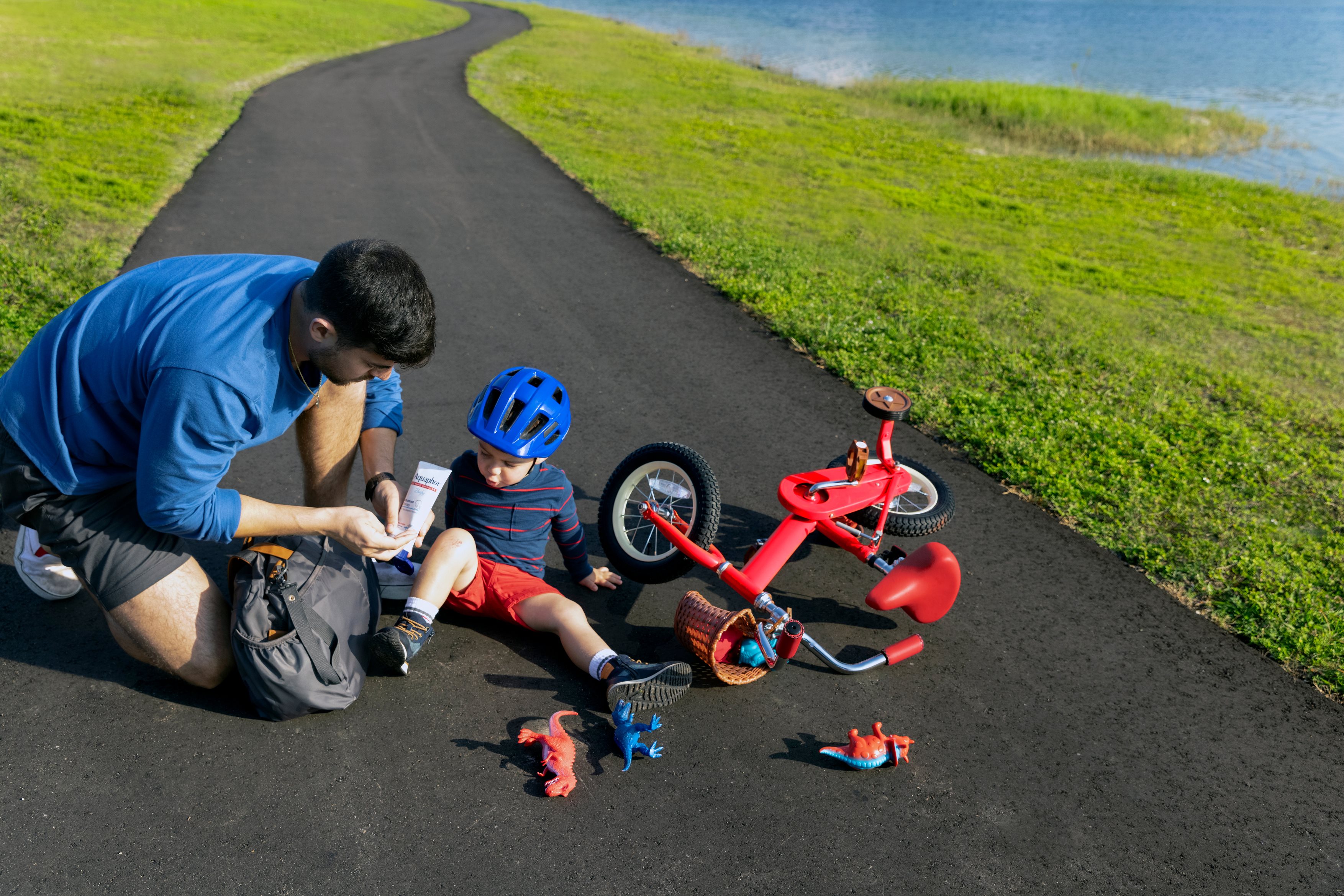man applying Aquaphor on scrape