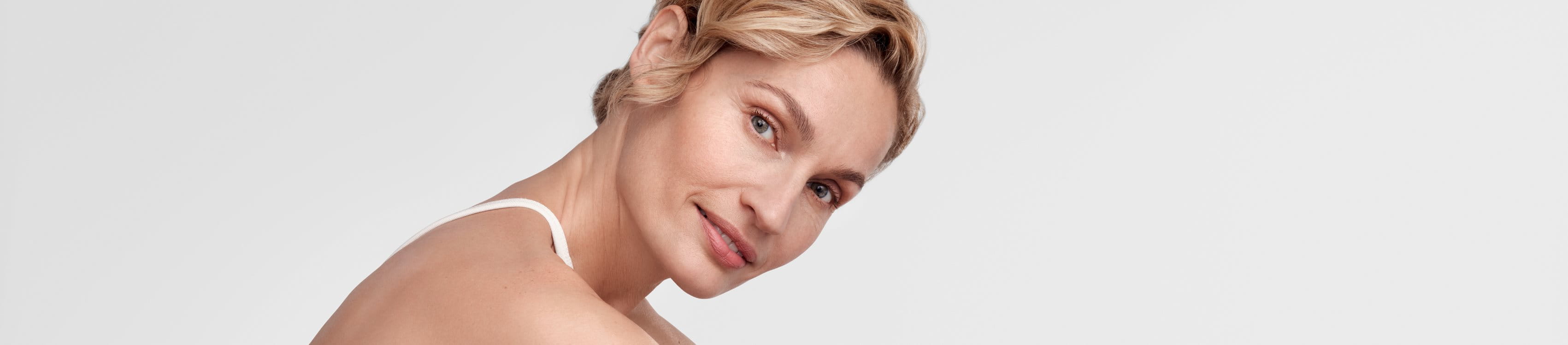 Woman holding her face smiling