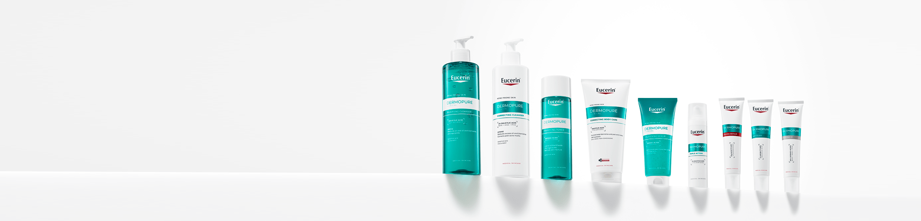 Volto di ragazza con punti a tendenza acneica evidenziati e prodotti in primo piano