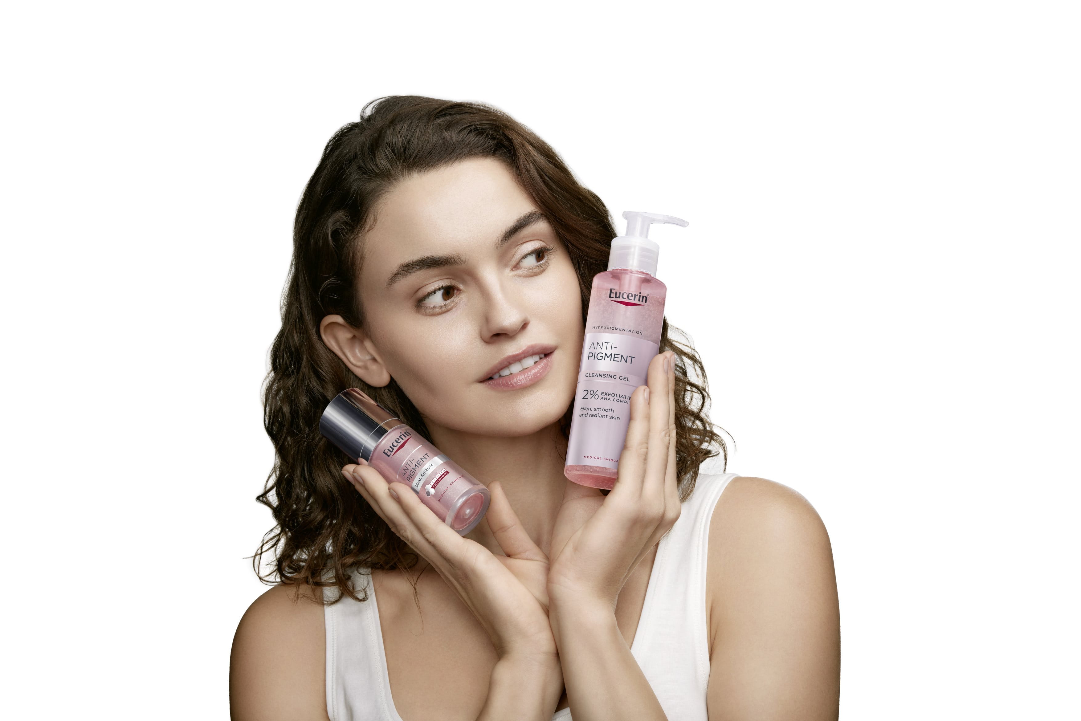 Woman holding anti-pigment product