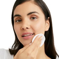 Woman washing her face