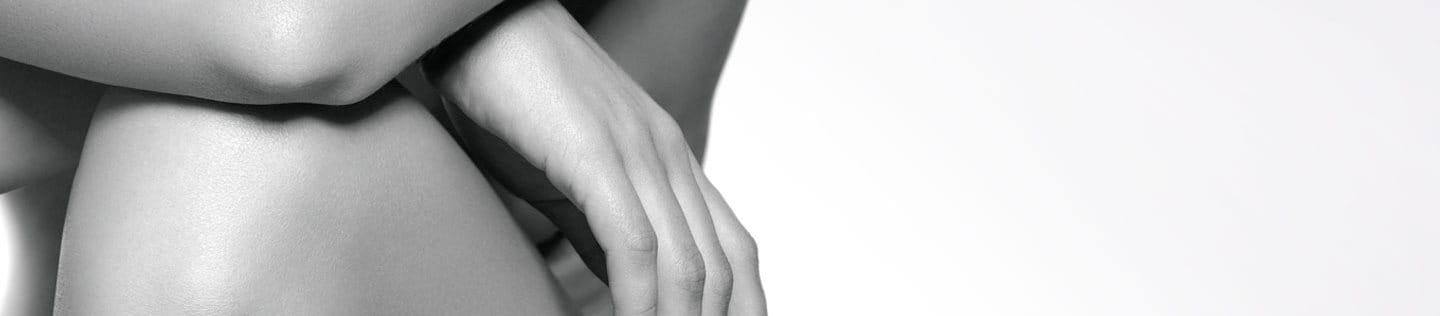 Woman leaning with her elbow on her knee