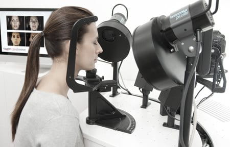 Woman´s face gets checked with high-tech apparatus