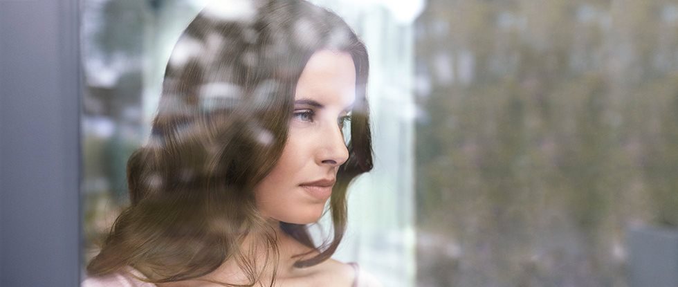 Woman looking out of the window