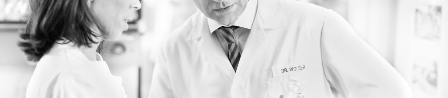 Dr. Rainer Wolber, Head of Product Development, DermoCosmetics is talking to a skincare scientist