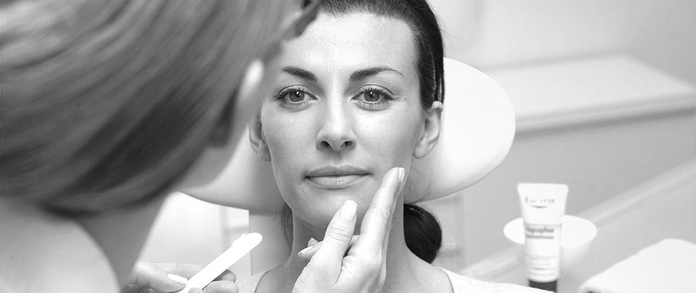Woman´s face gets treated with Eucerin product