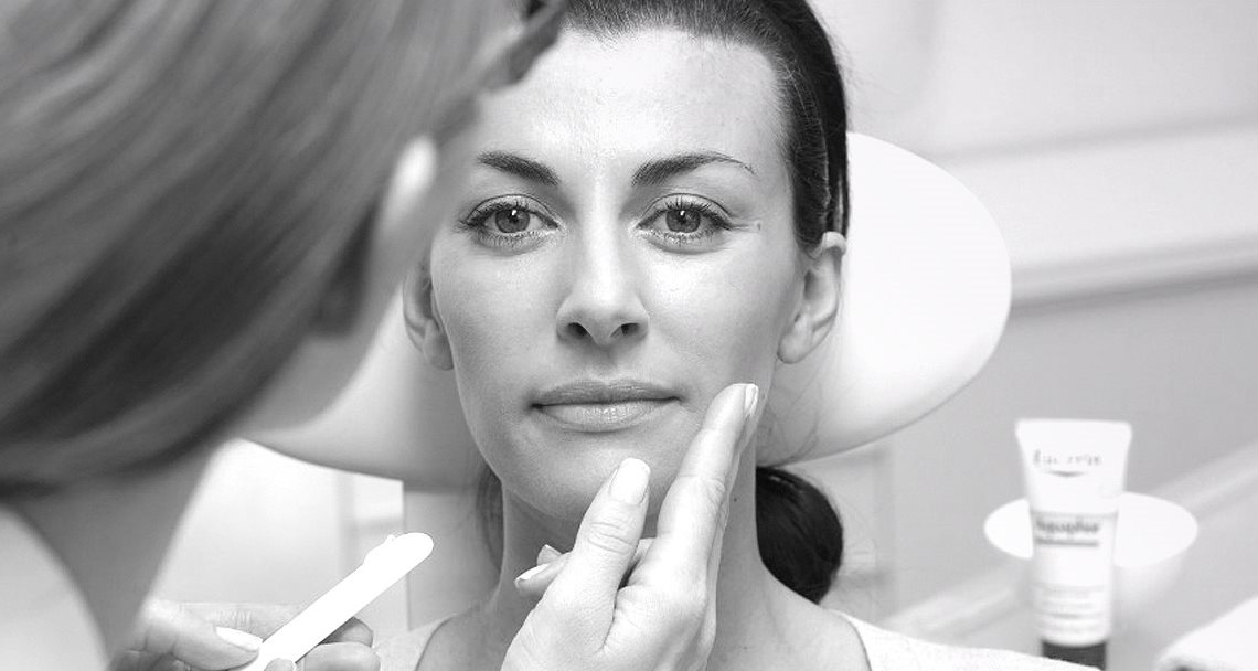 Woman´s face gets treated with Eucerin product