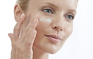 Women Applying Gel On Face 