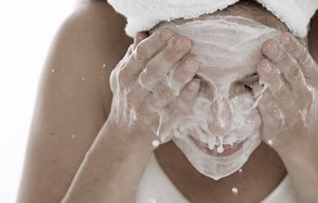 Woman washing her face