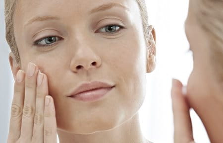 Woman using face skincare