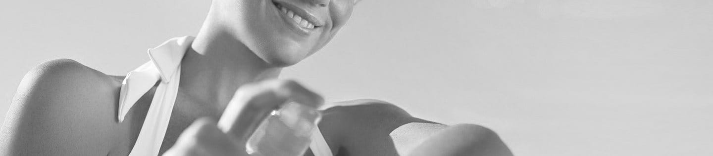 Woman applying sunscreen on her arm