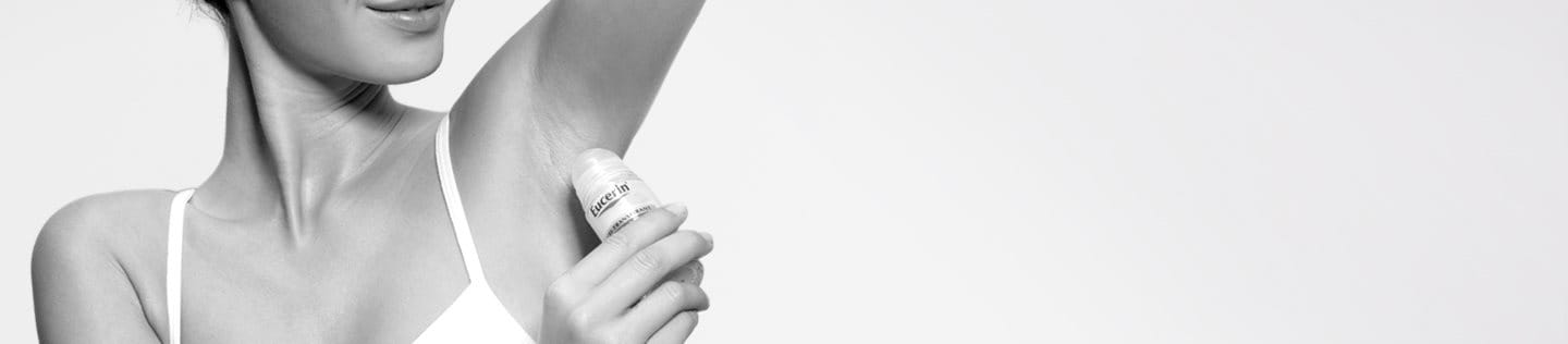 Woman using Eucerin 48 h Anti-Transpirant Roll-on