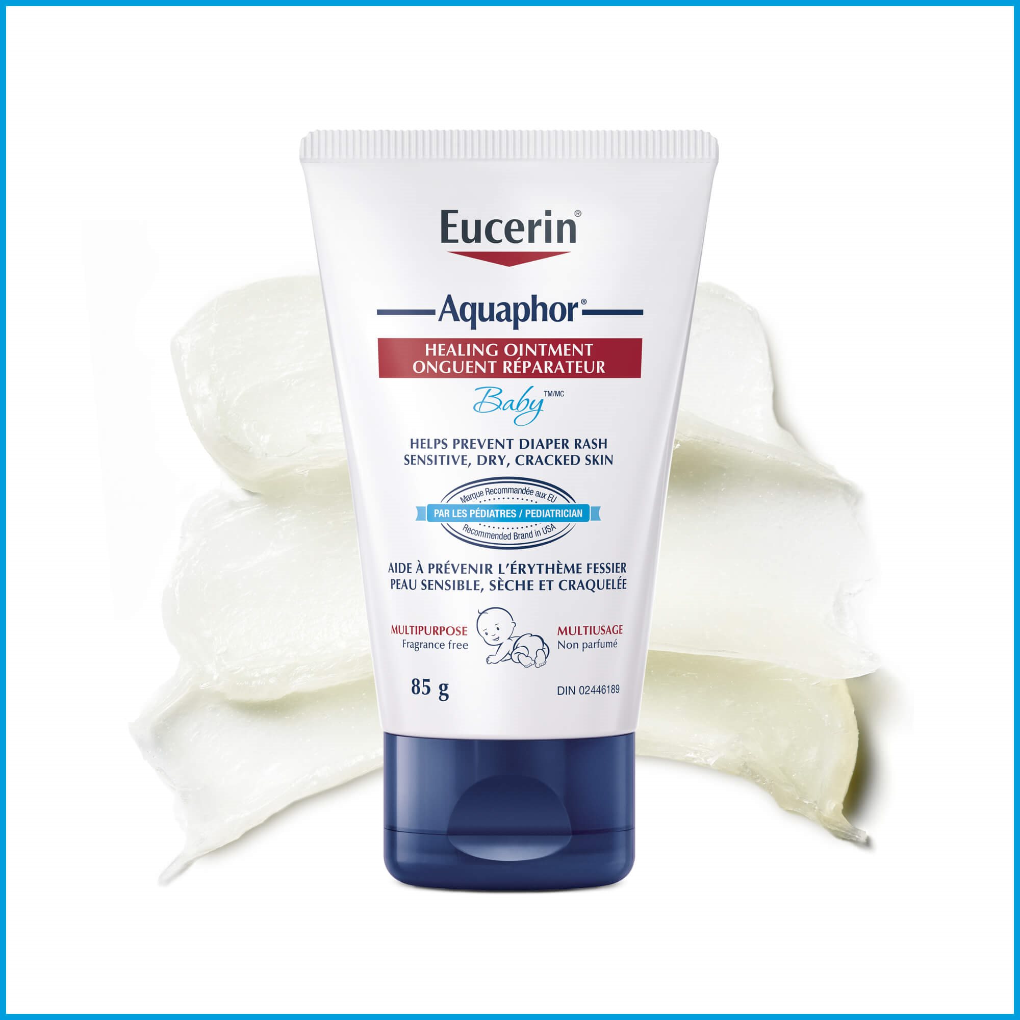 View of Eucerin Aquaphor healing ointment 85g with product smeared behind against a white background.
