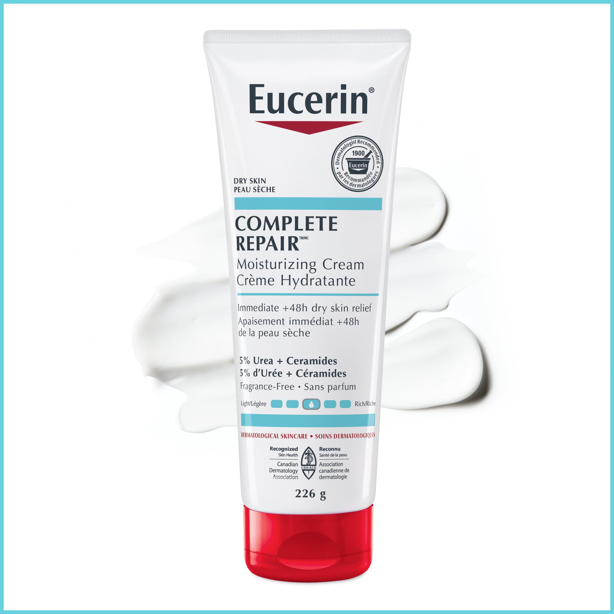 Closeup view of Eucerin Complete Repair Cream against a white surface with product spread behind it.