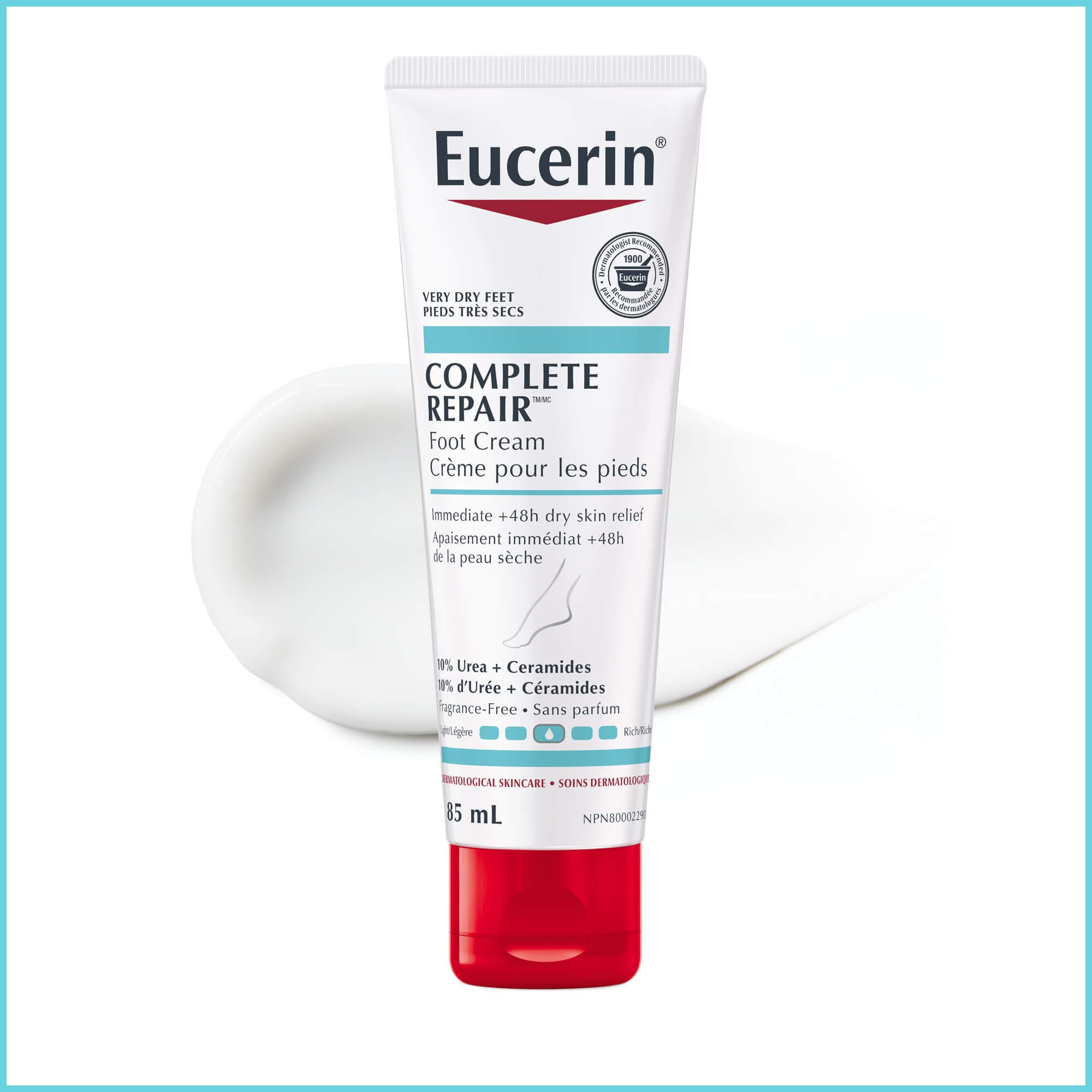 Image of the Eucerin Complete Repair Foot Cream laying against a white background with product spread behind it.