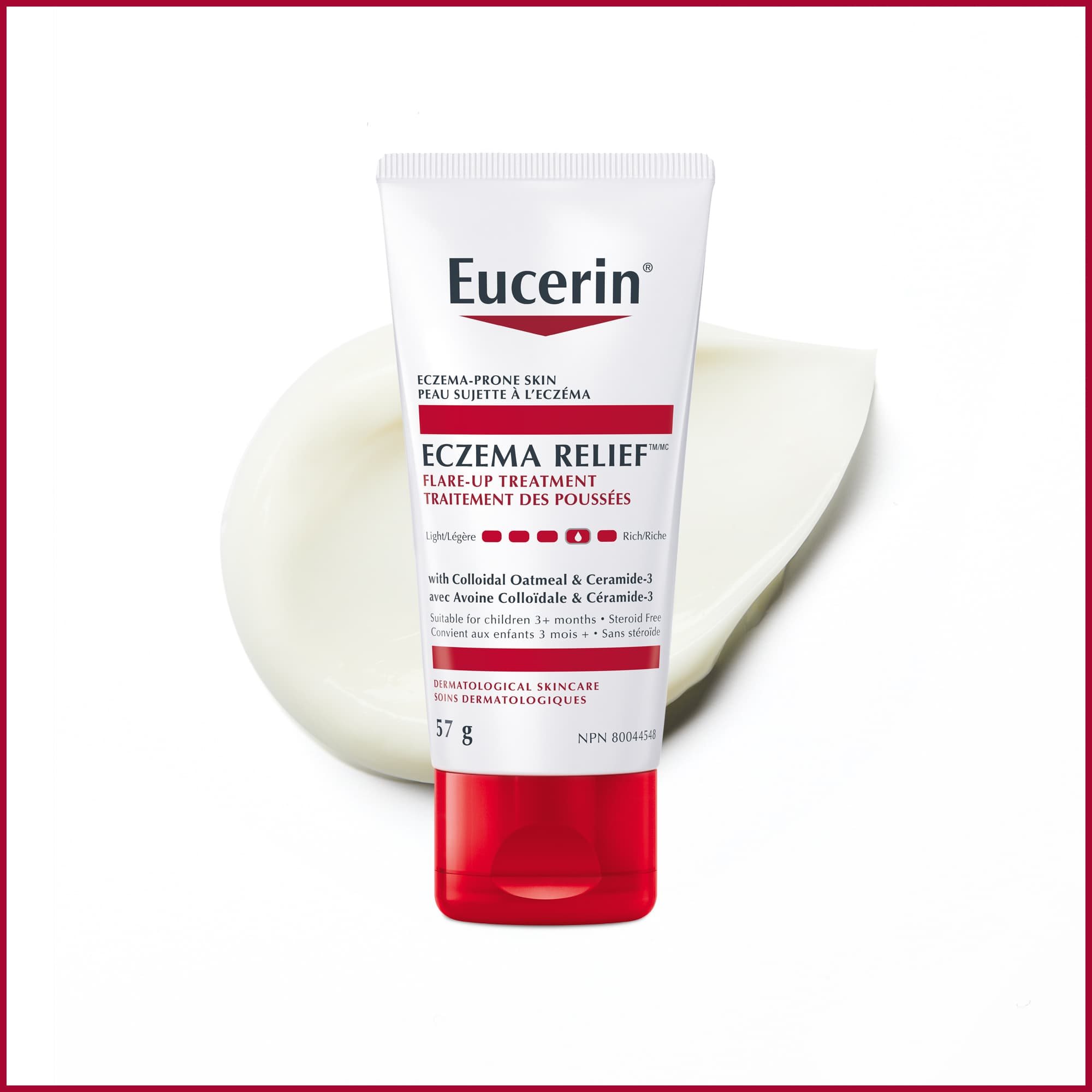 Bouteille de crème Eucerin 57g pour le traitement des poussées d'eczéma avec traînée du produit en arrière-plan.