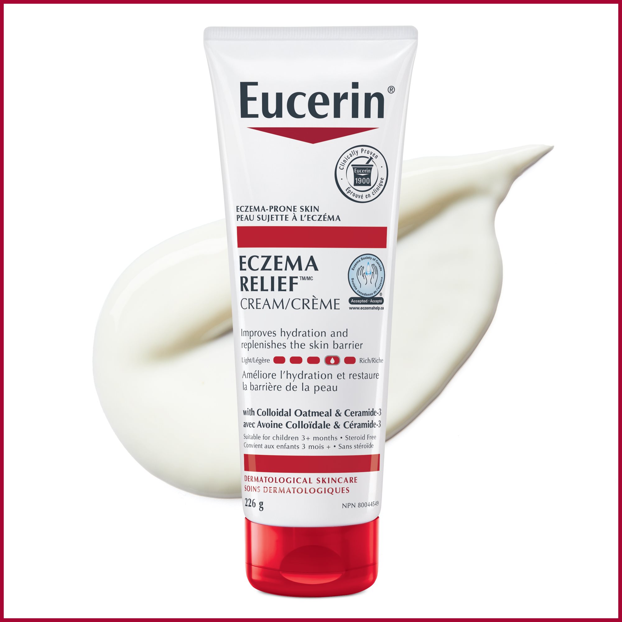 Bouteille de crème Eucerin 226g pour peau sujette à l'eczéma avec traînée du produit derrière, sur fond blanc.