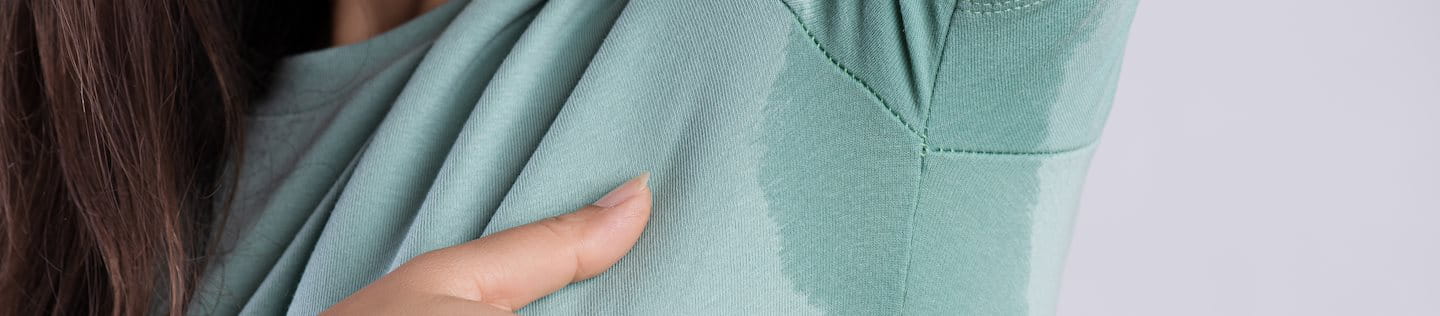 Schweißfleck unter der Achsel