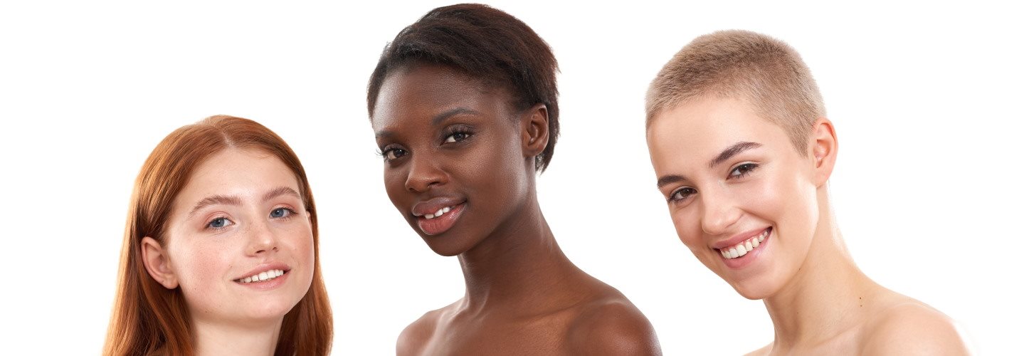 Drei Frauen mit unterschiedlicher Hautpigmentierung