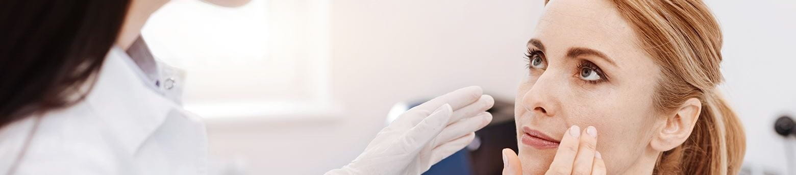 Woman being inspected by a doctor