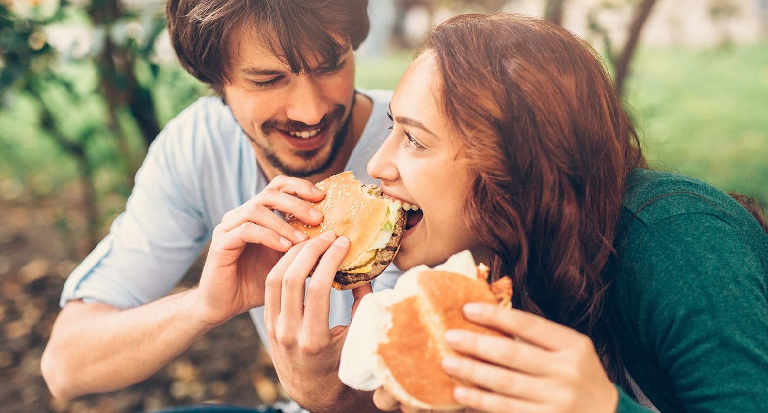 A couple sharing a burger
