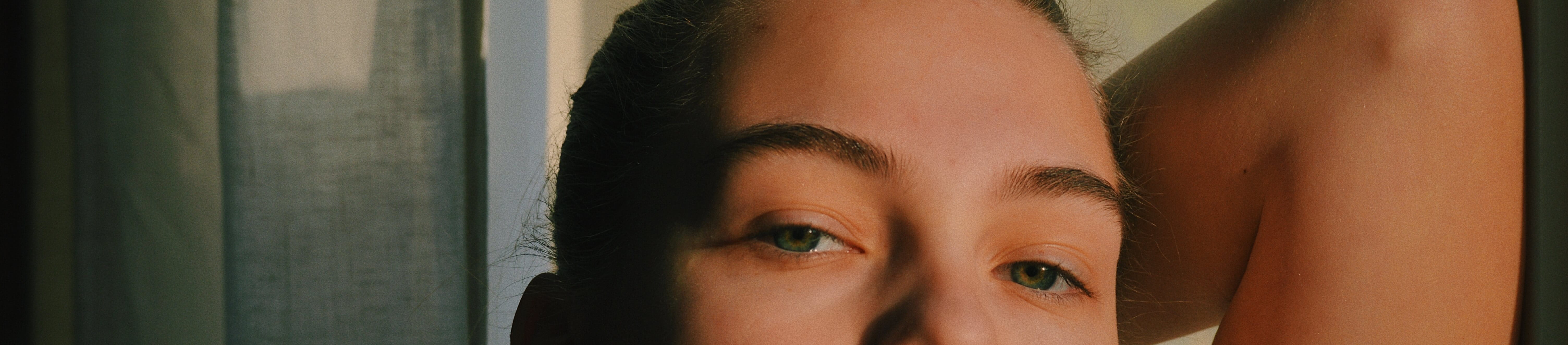 Close up headshot of female with combination skin