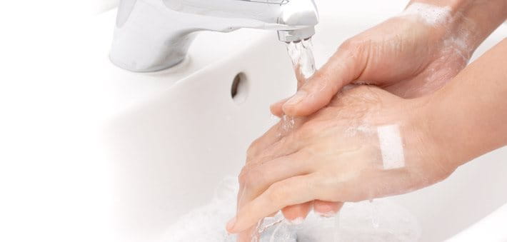 Washing hands under running water