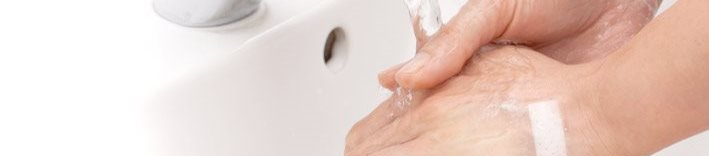 Washing hands under running water