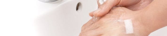 Washing hands under running water